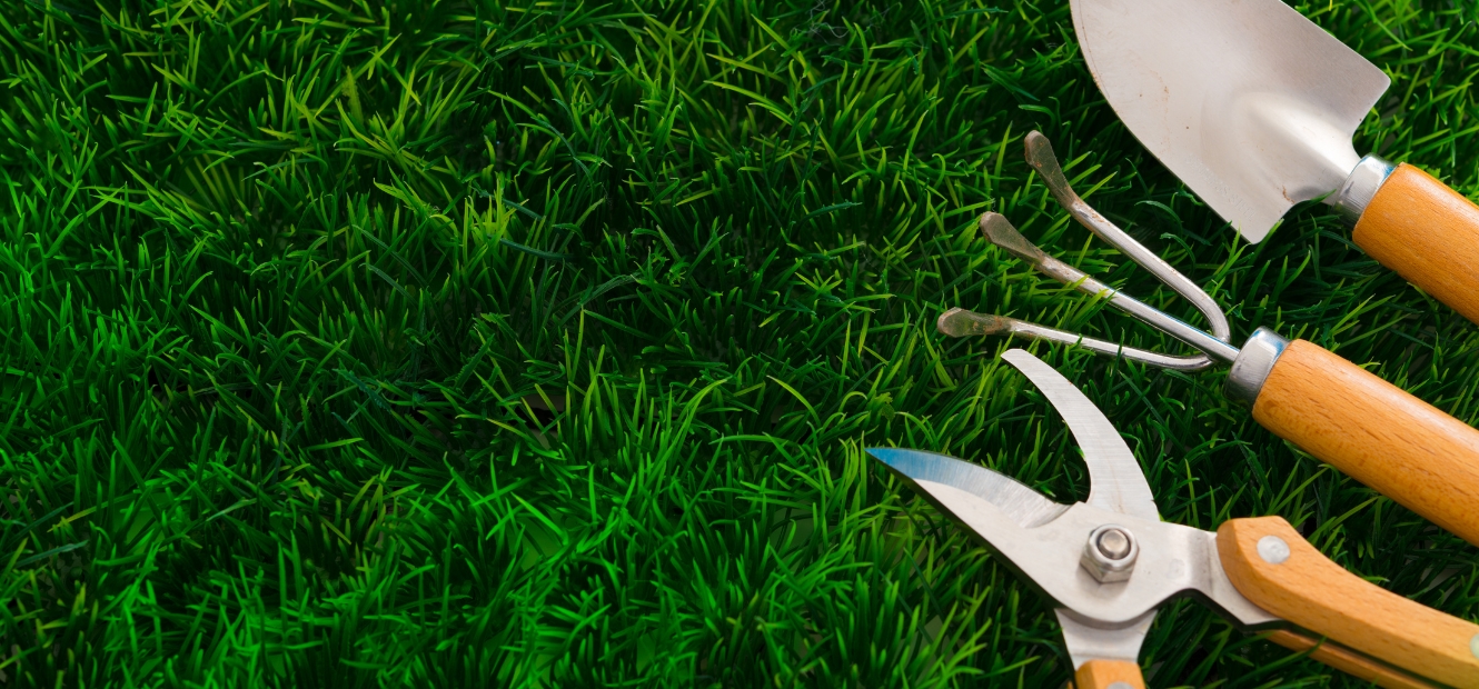 Garden tools laying on the grass